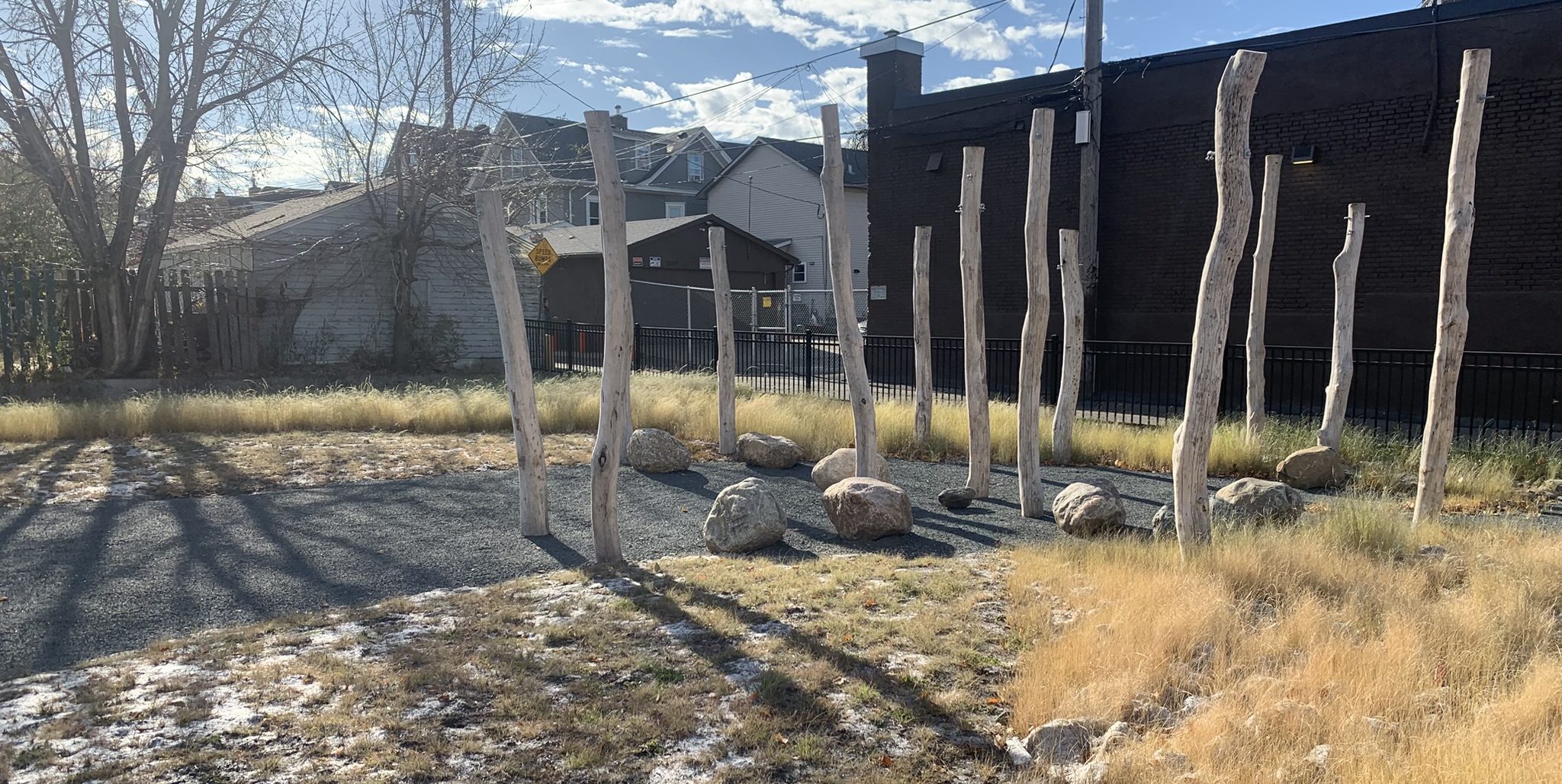 black locust poles and boulders in a public park
